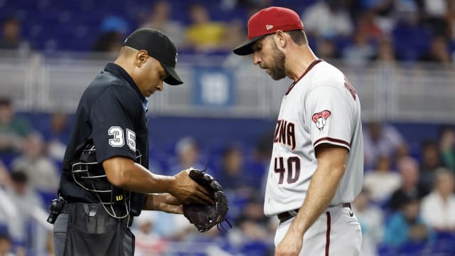 Madison Bumgarner has his glove inspected in Miami